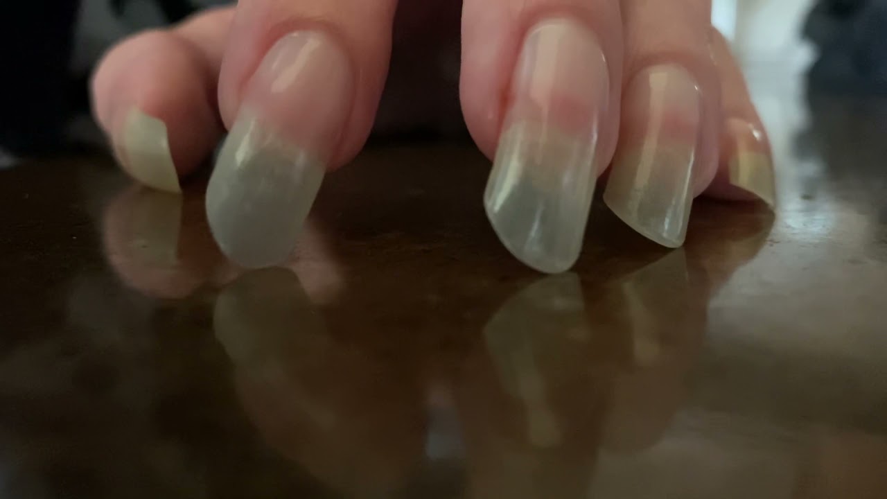 Long Natural Fingernails Tapping in Boredom on Granite Countertop