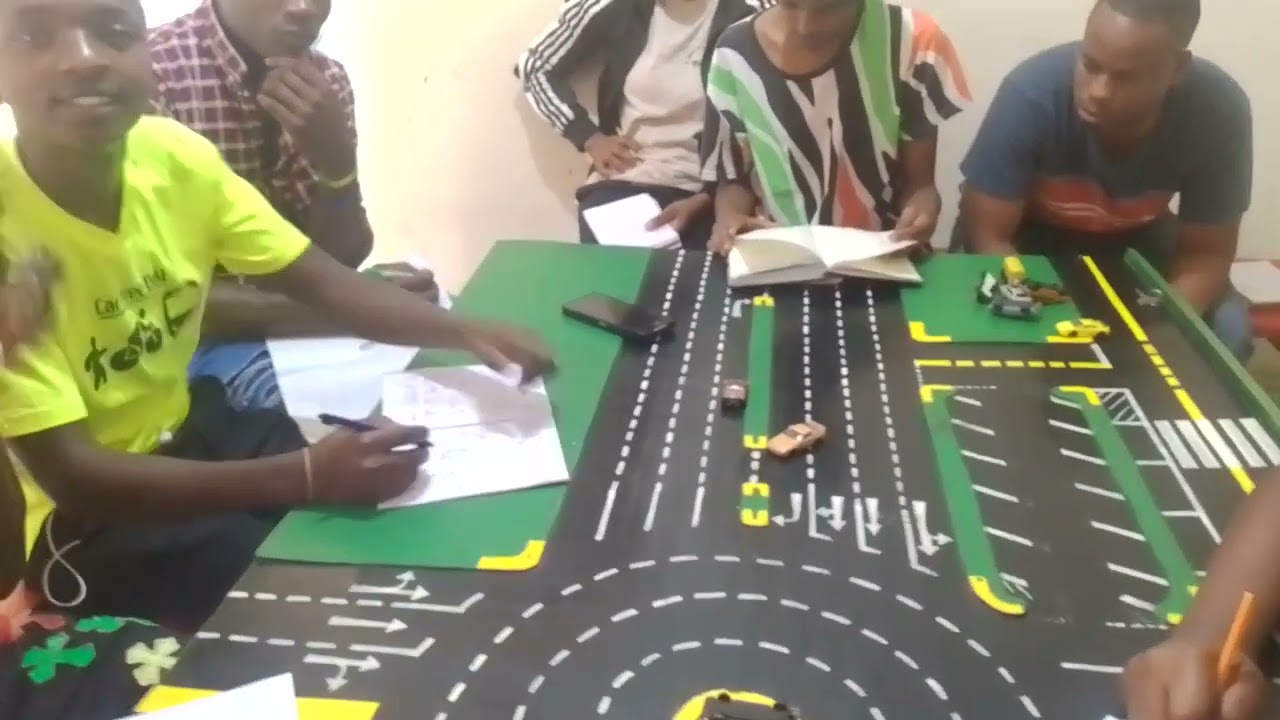TRICKY NTSA EXAMINED QUESTIONS AND ANSWERS 2023 .BY INSTRUCTOR DAVID RED VEHICLE INFRONT OF GREEN .