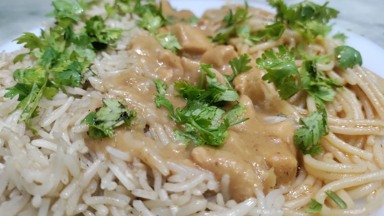 Garlic Rice Delight with Tomato Spaghetti and Saucy Chicken