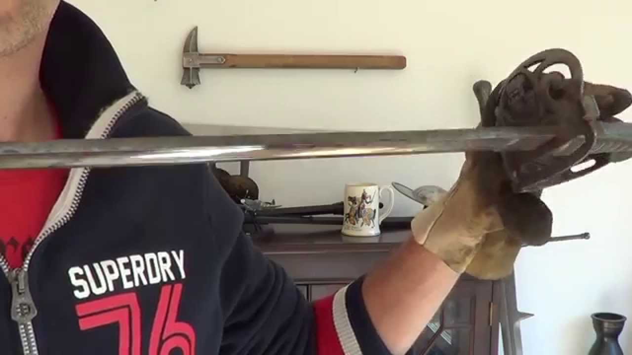 Cleaning antique or modern swords and knives with a buffing wheel