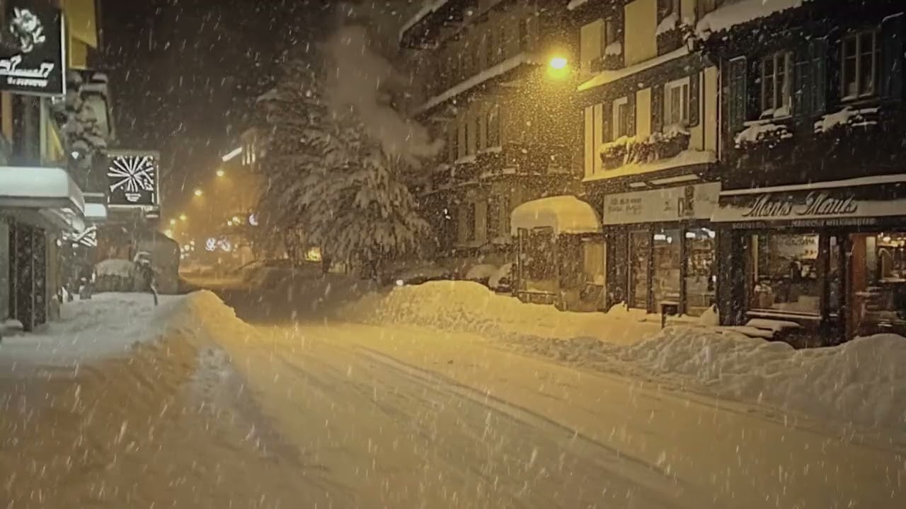 A Small Street in Winter with Snow Falling and No One Around
