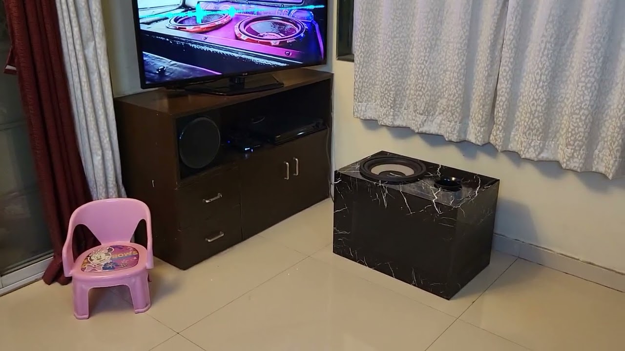 Car subwoofer in oversized ported box shaking doors and windows with extreme ultra low frequency.