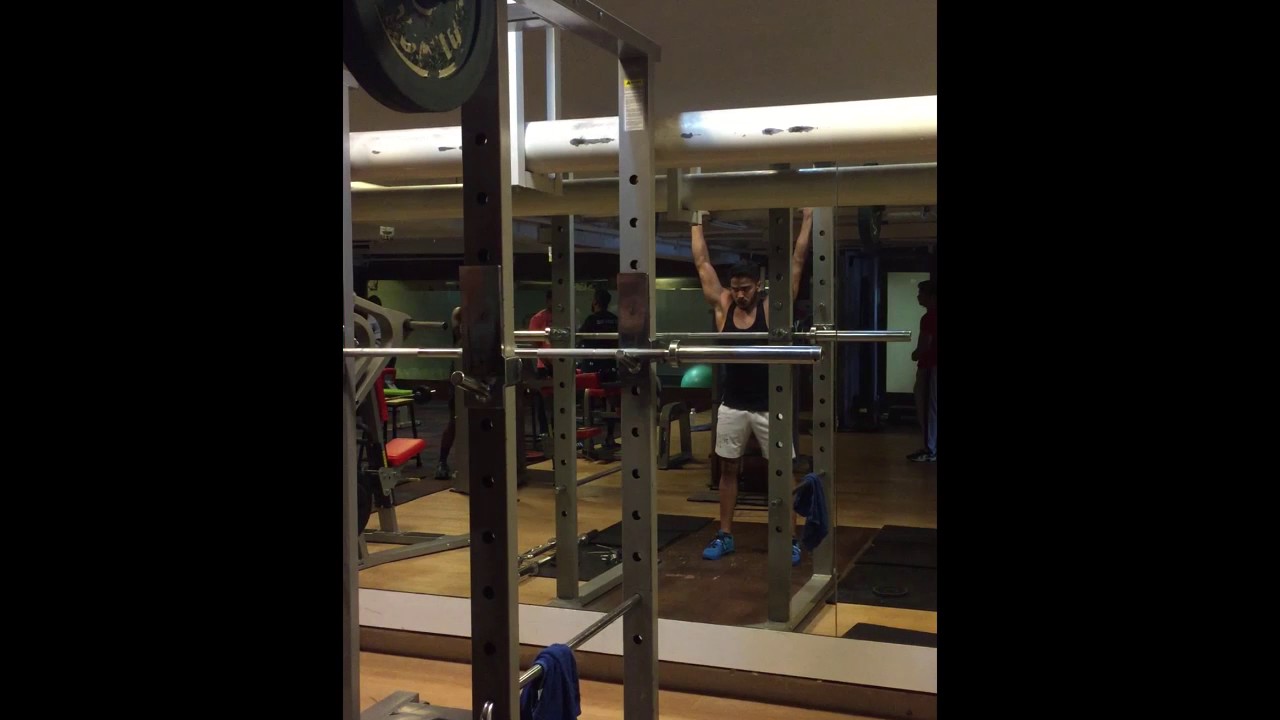 Patel Doing the Barbell Overhead Press