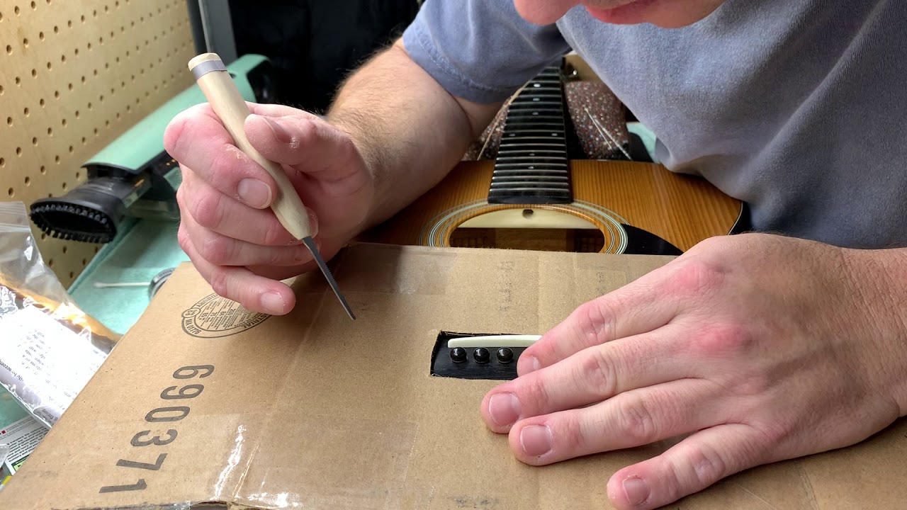Slotting an acoustic guitar bridge for unslotted pins