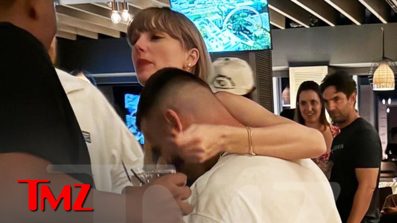Taylor Swift Wraps Arm Around Travis Kelce's Neck in First PDA Photo | TMZ Live