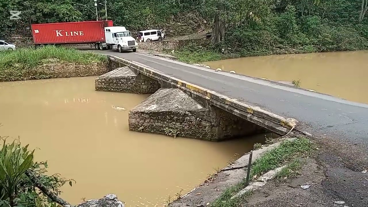 Trucks going across the most dangerous bridge in Jamaica #flatbridge