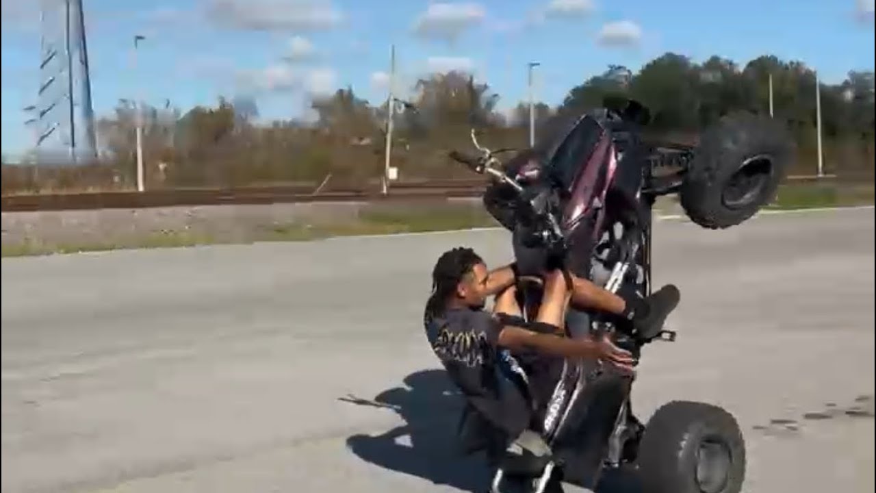 Turning corners in a wheelie on my trx450!!!