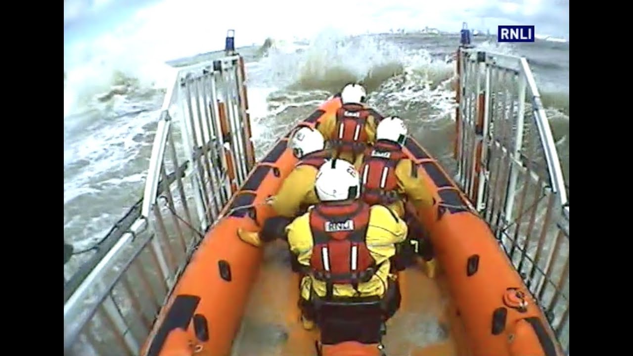 RNLI New Brighton battle dangerous rough seas to save dog.