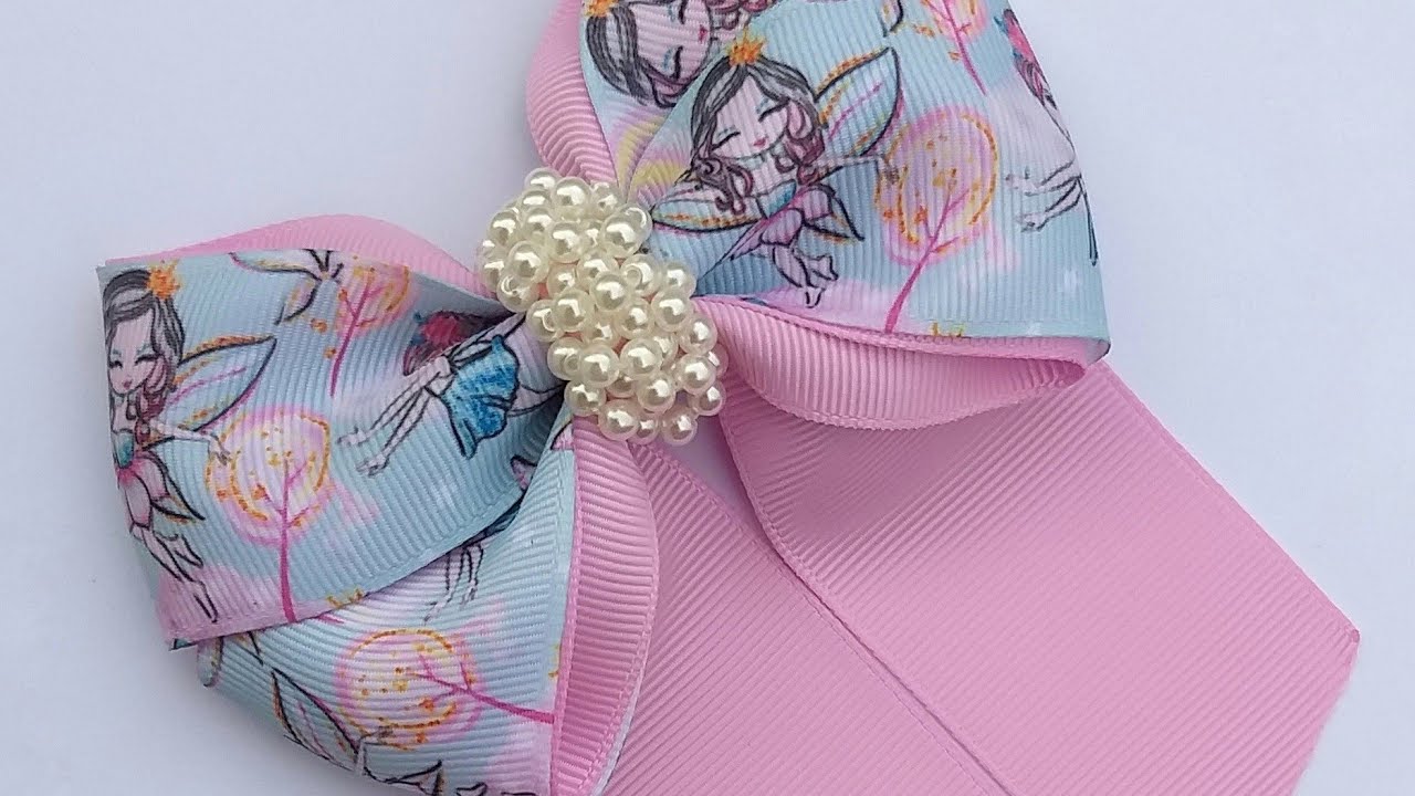Laço cruzado (arco íris) com pontas 🎀Fita N 9