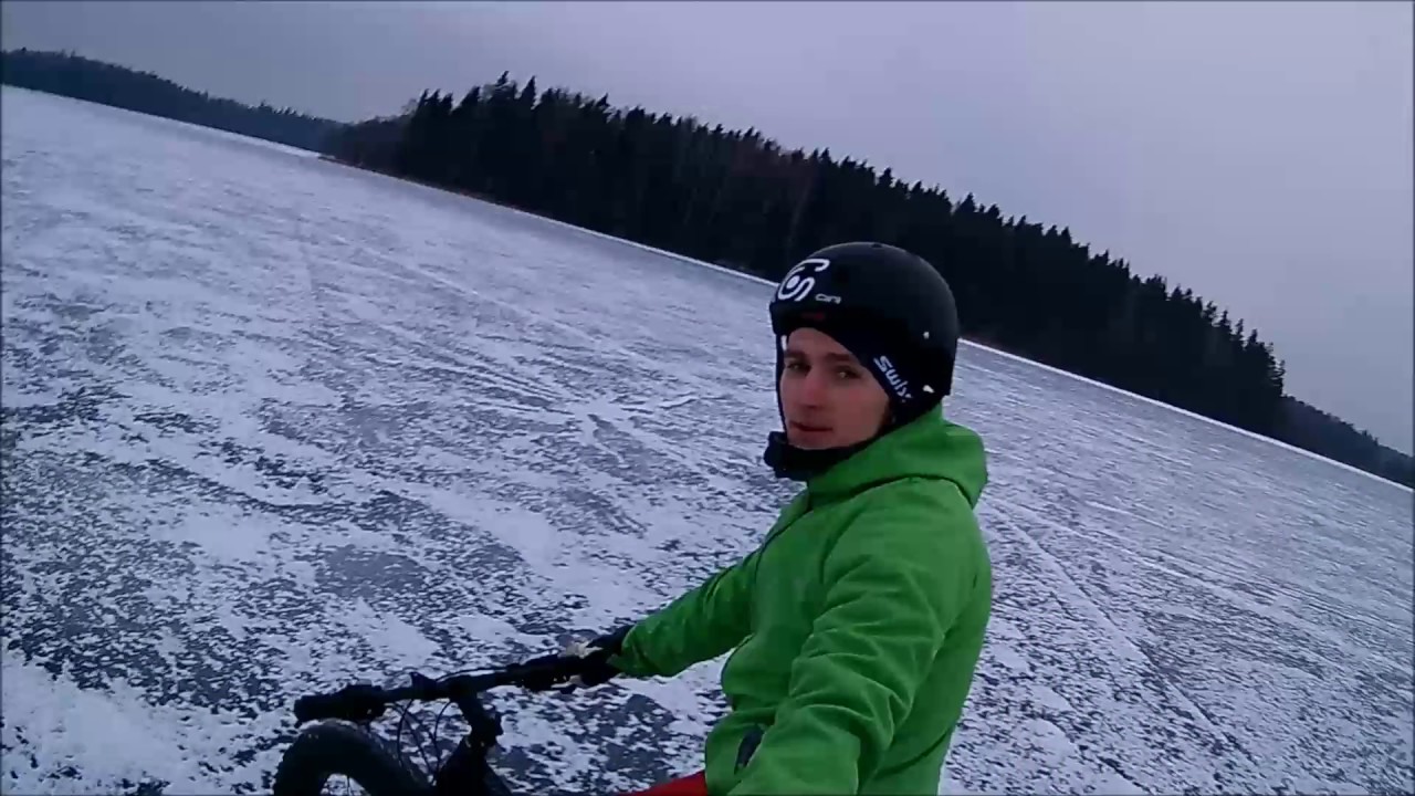 Cycling with fatbike on frozen lake to the island