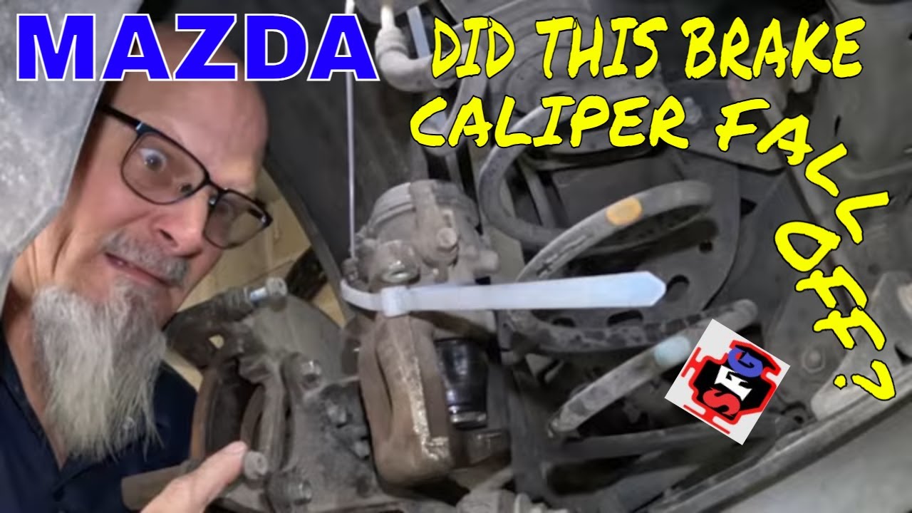 Why is this Brake Caliper Strapped to the Rear Shock?