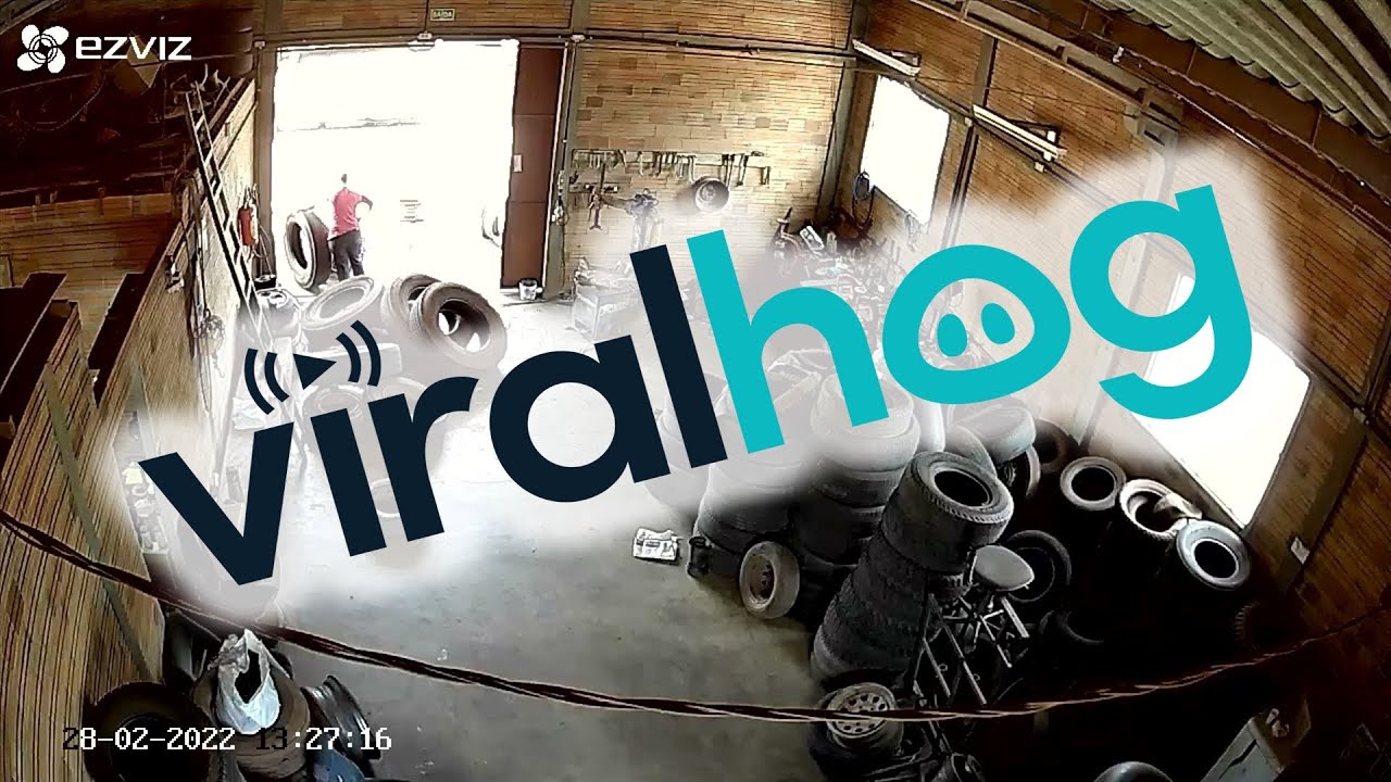 Tire Explodes in Repair Shop and Almost Hits Couple || ViralHog