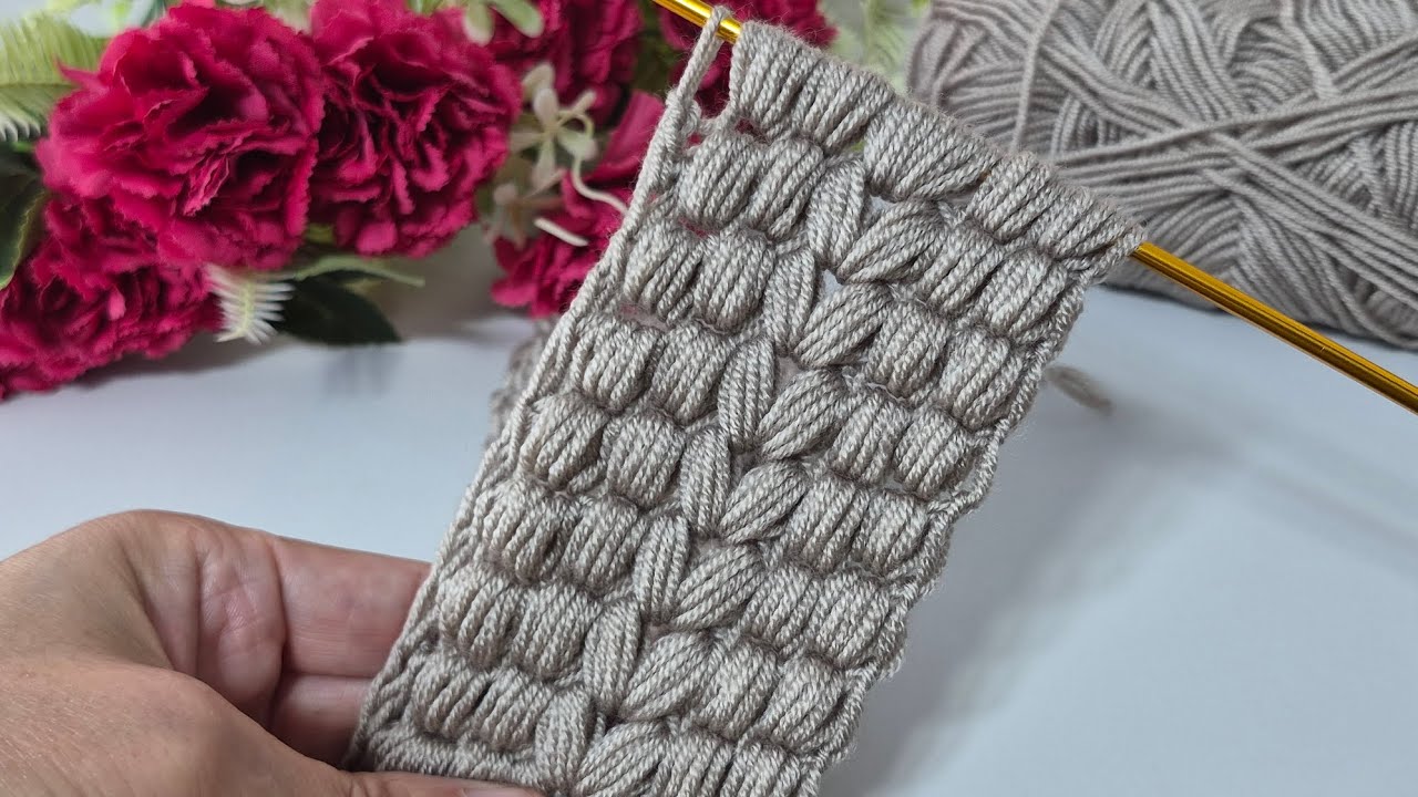 Continue to knit a wonderful Tunisian knitted headband model