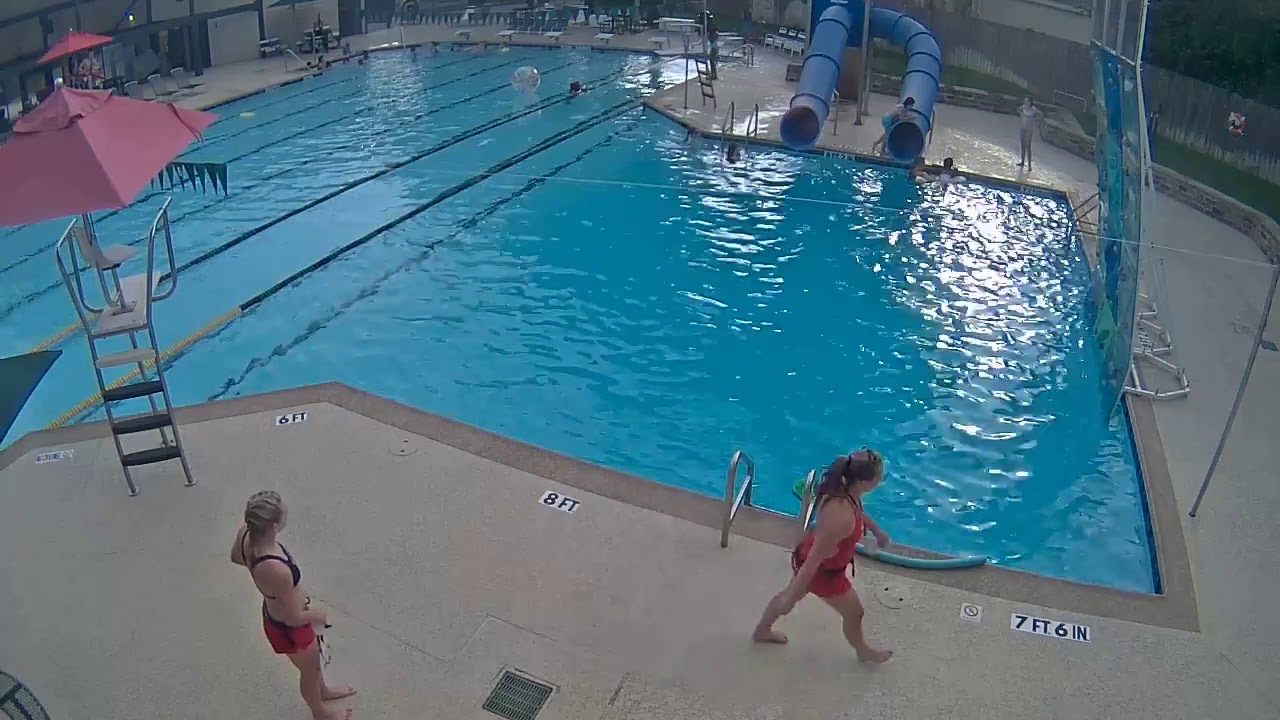 CAUGHT ON CAMERA: Lifeguard Saves Young Girl from Drowning in Neighborhood Swimming Pool