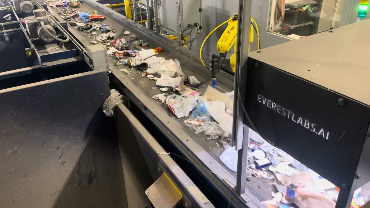 An AI robot picks up cans at The Exchange, an LRS recycling sorting center in Chicago.