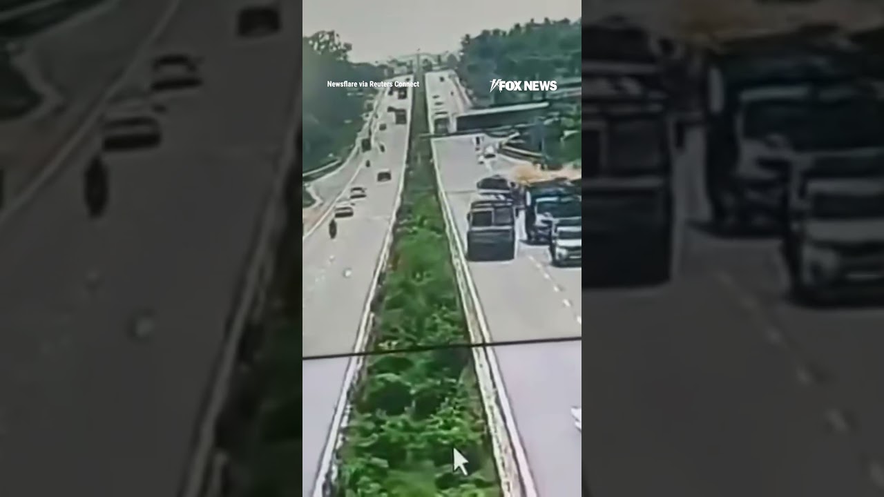 Surveillance video shows truck losing control after slamming into tractor