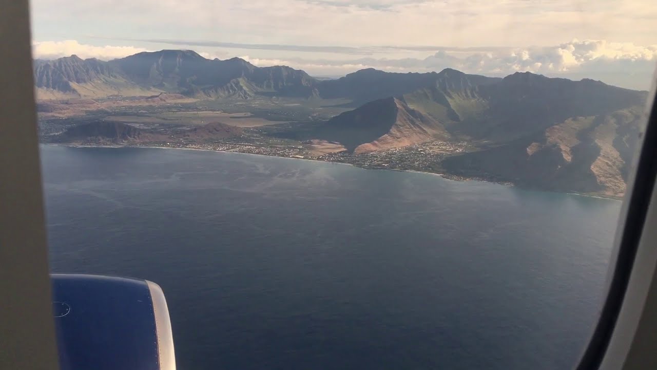 Flying into Hawaii over Pearl Harbor and Disney Resort, landing in Honolulu