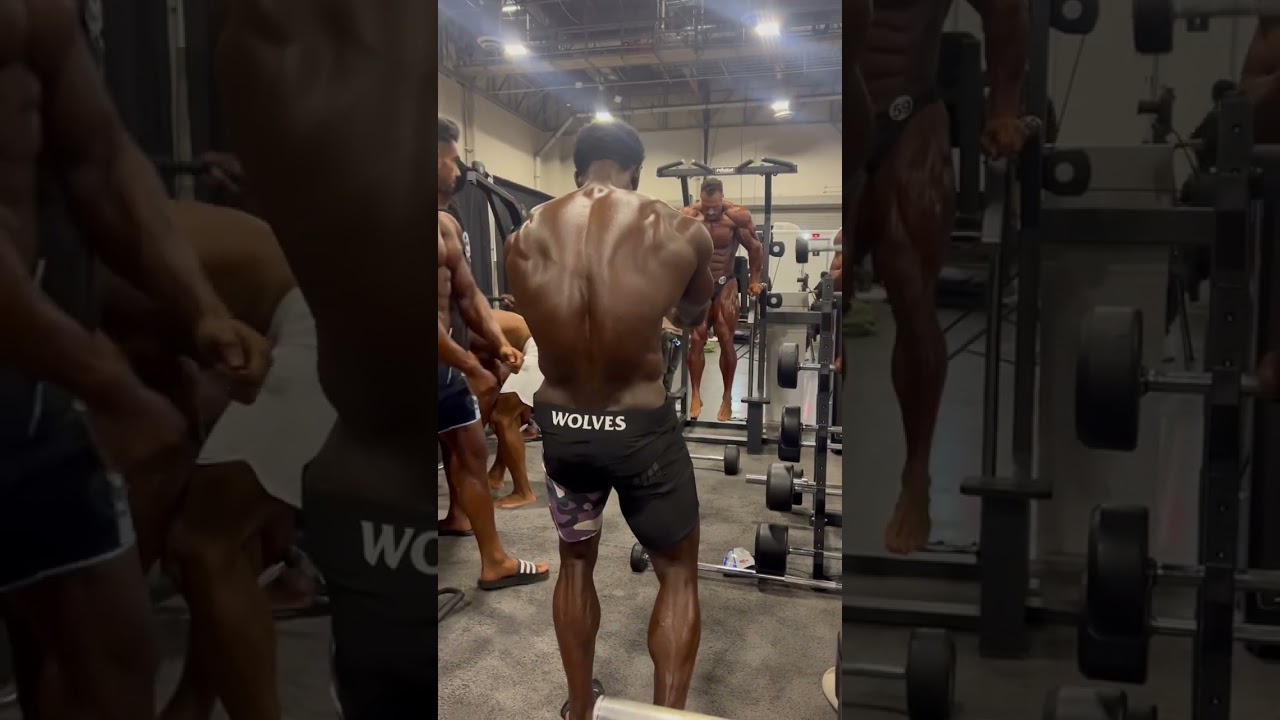 IFBB Pro men&rsquo;s physique George Brown backstage posing and ready to battle at the 2022 Mr. Olympia!