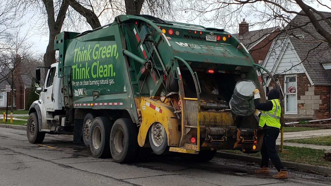 Waste Management: CNG McNeilus Rear Loader Packing Trash