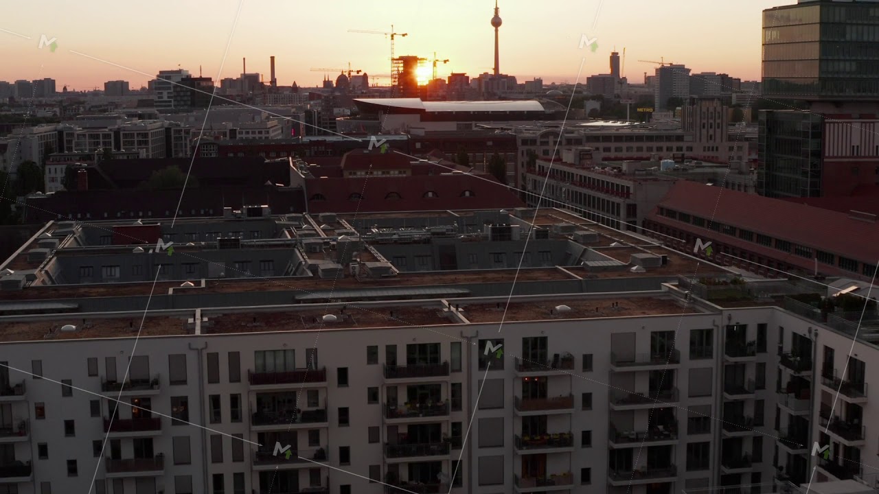 AERIAL: Flight over Berlin, Germany at beautiful Sunset, Sunlight and view on Alexanderplatz TV