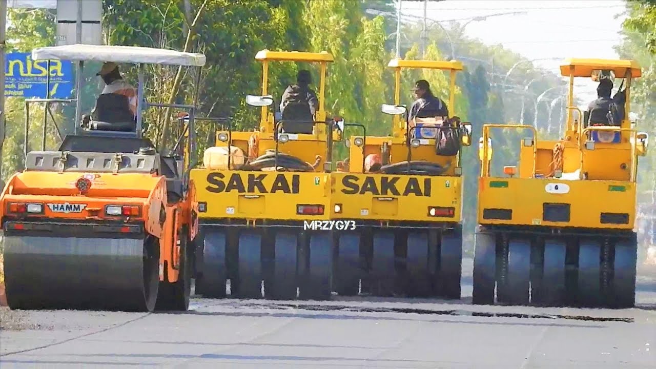 Road Construction Asphalt Paver Dump Truck And Tire Roller Working