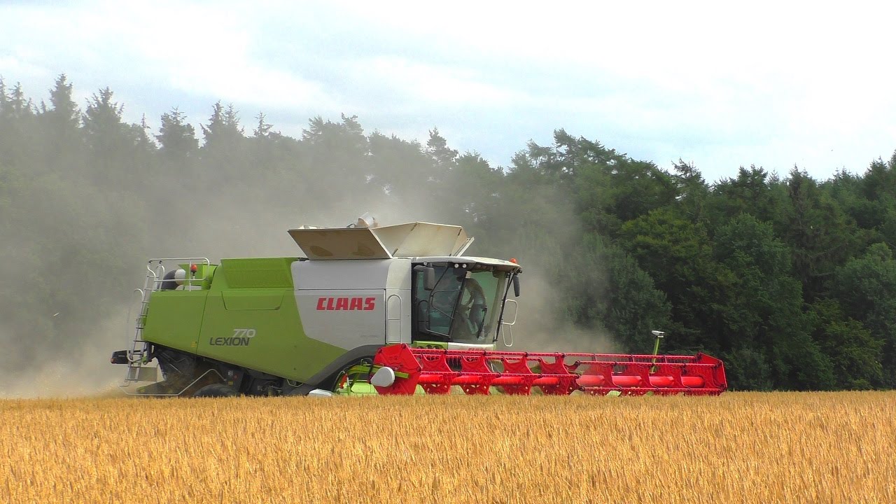Claas Lexion 770 TT mit Vario 1200 und Fendt 936 mit Hawe Überladewagen bei der Getreideernte 2015