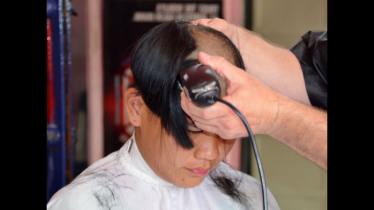 Girl barbershop long hair to bald