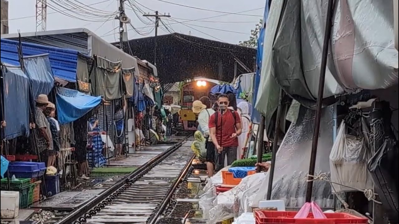 Maeklong Railway Market – The Train That Passes Through a Market!