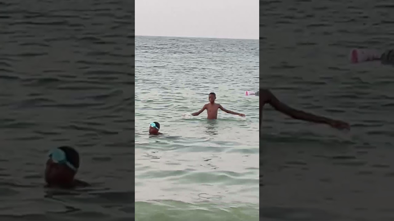 Muhammad swimming at Mamzar Beach Dubai with friends
