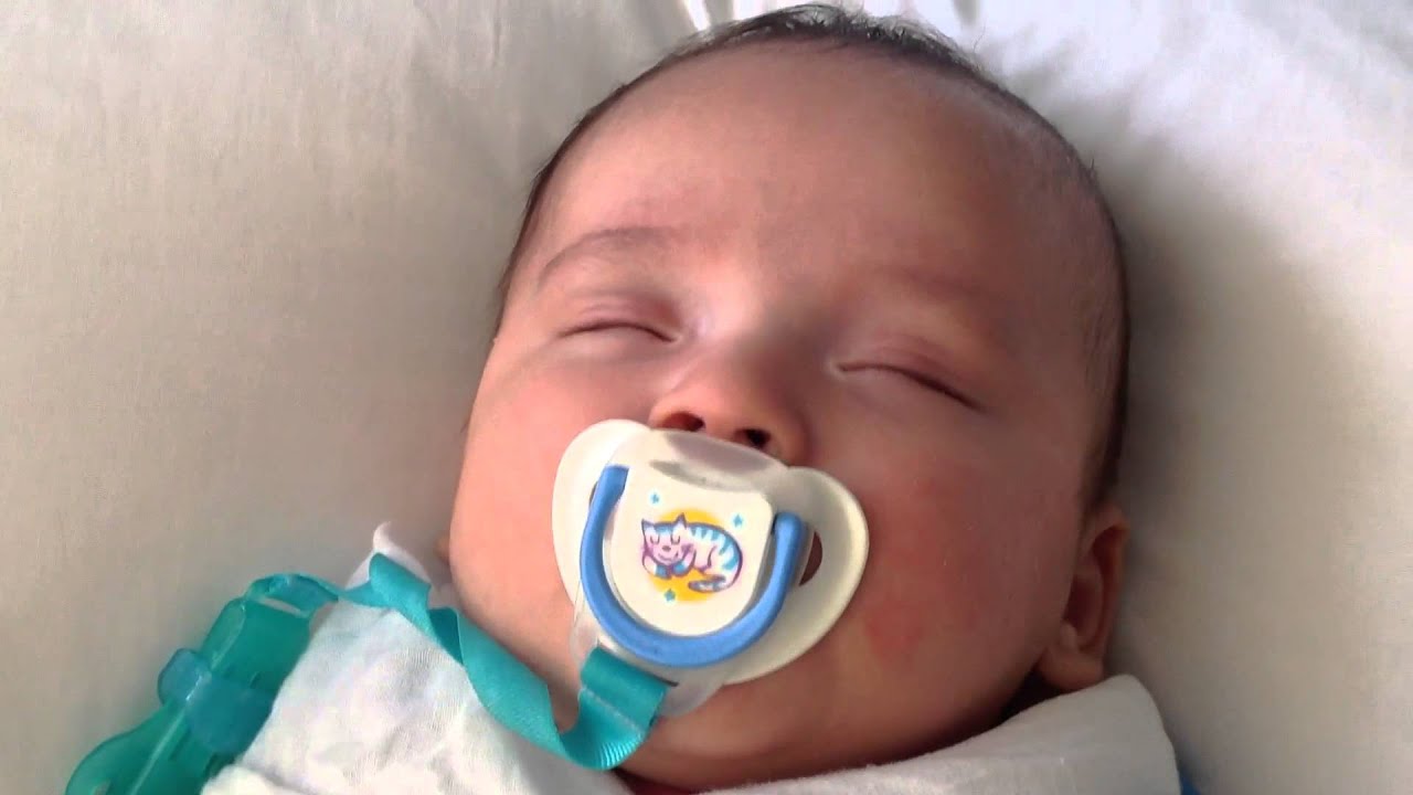 Cute little baby sucking on his dummy