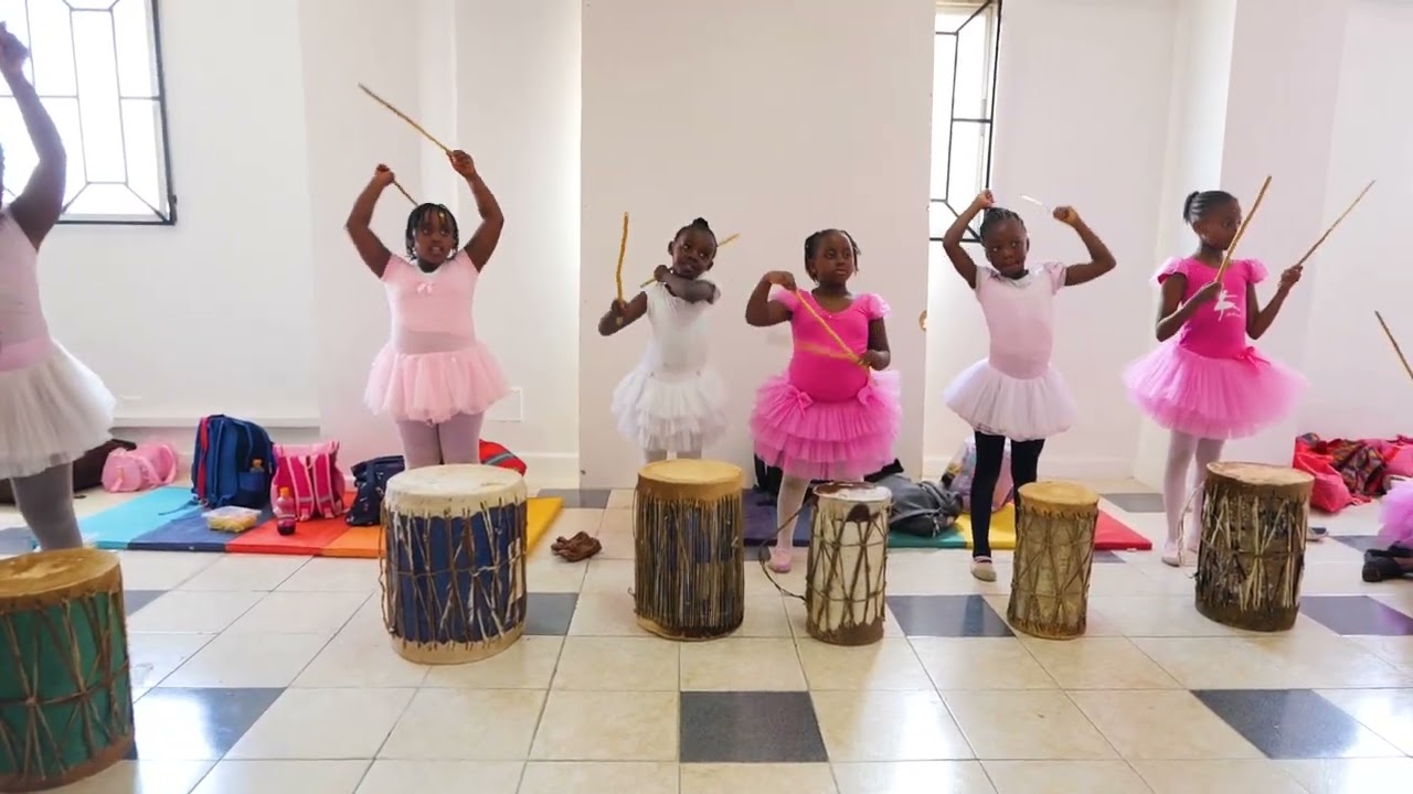 CHILDREN ENJOYING SOME DRUM JAM