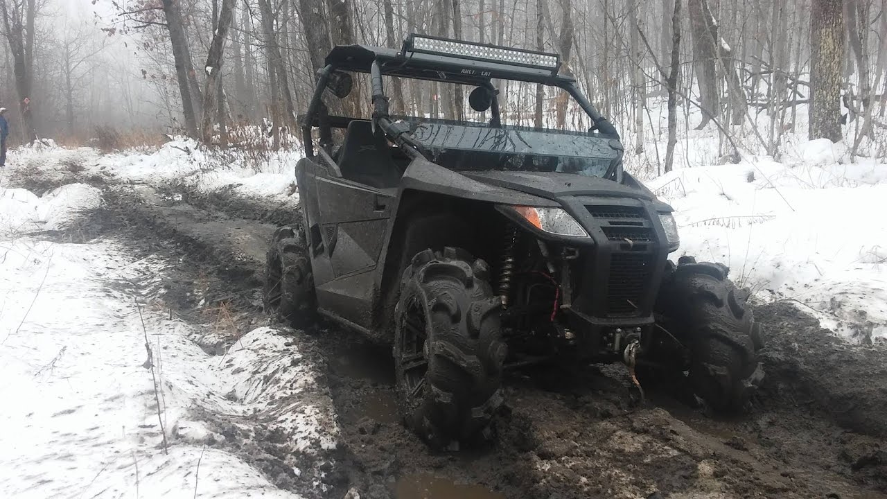 arctic cat wildcat trail xt 700 limited  muddy snowy trail