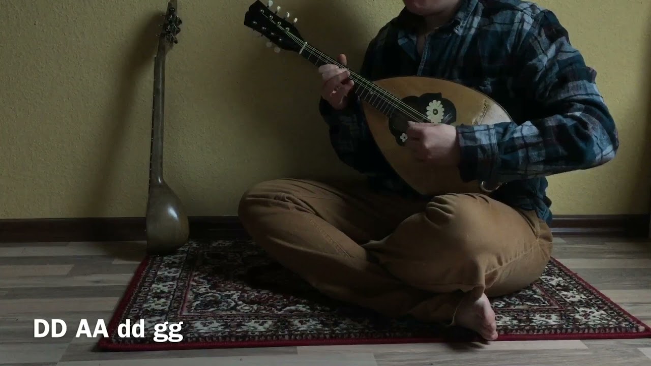 Mandolin played in Algerian mandole style - DD AA dd gg tuning