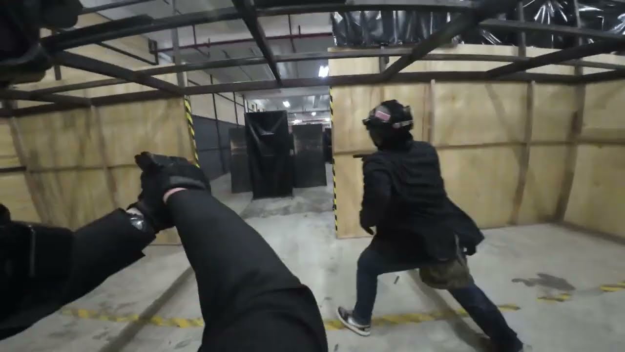 A group of idiots wearing suits to an airsoft game