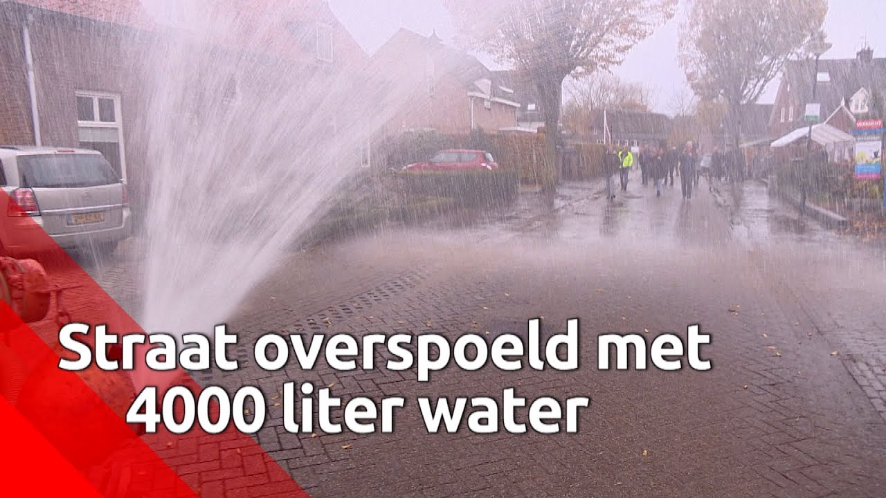Giertank zet straat in Den Dungen onder water