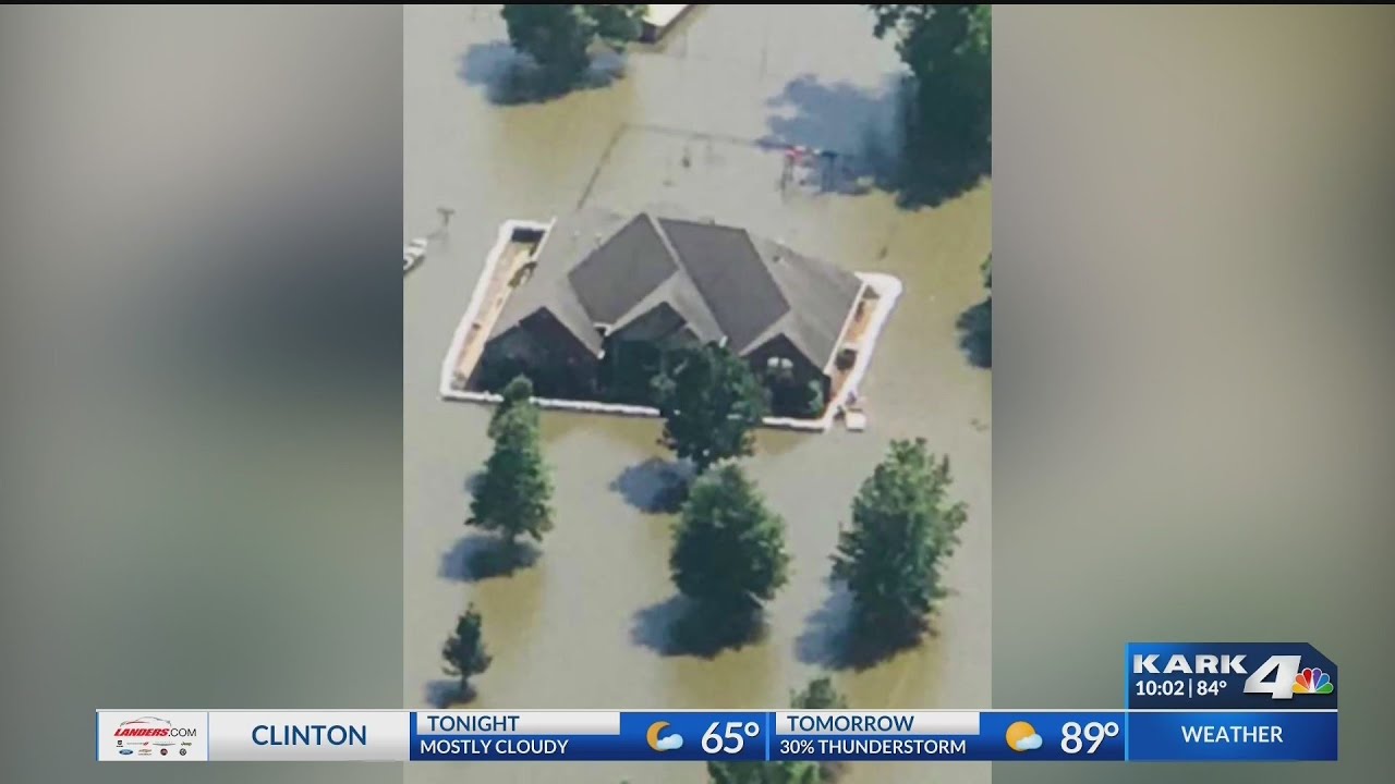 Wooster Flooding; Family builds wall around house