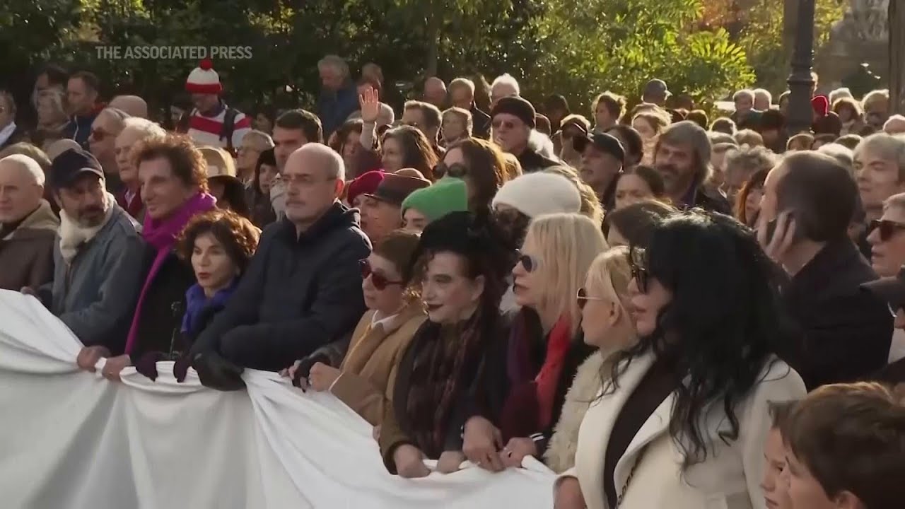 French performers lead silent march for peace