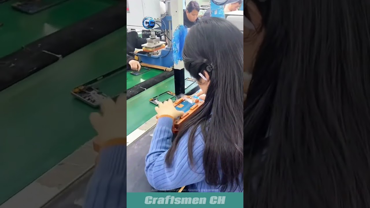 Assembling mobile phones -- workshop assembly line operation