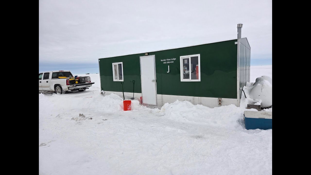 ICE FISHING. Joe and Melissa. Border View Lodge. Sleeper House on Lake of the Woods. Minnesota.