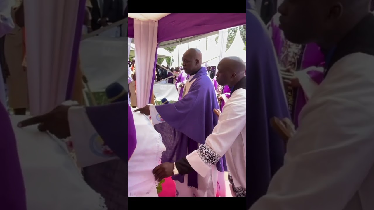 Bishops performing final rites in the Mass of the late bishop Charles