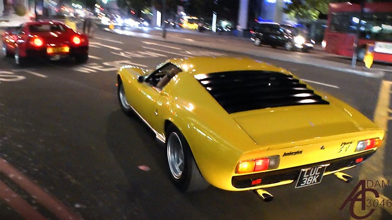 Lamborghini Miura and Ferrari 288 GTO driving together in London