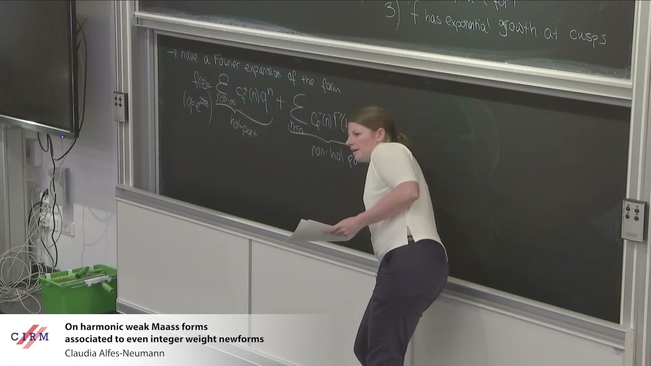 Claudia Alfes Neumann : On harmonic weak Maass forms associated to even integer weight newforms