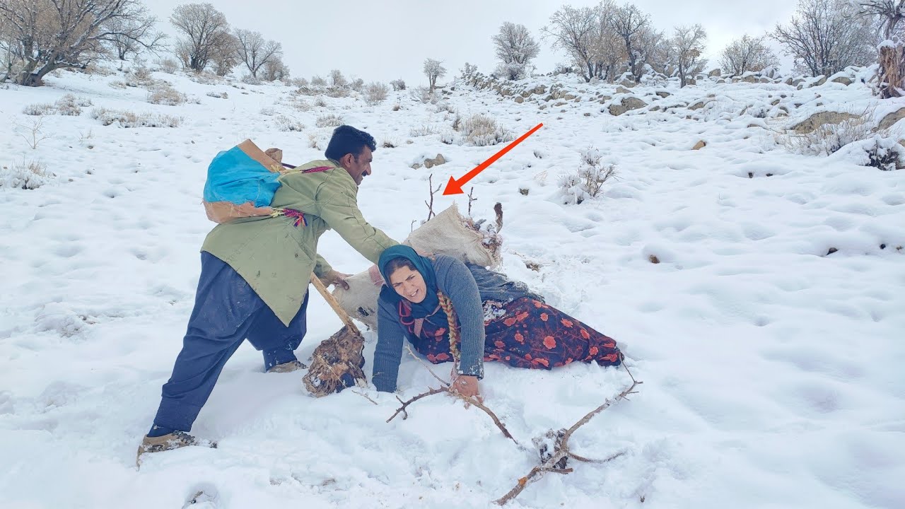 The moment of rescuing the nomad mother in a winter blizzard in harsh snowy conditions.