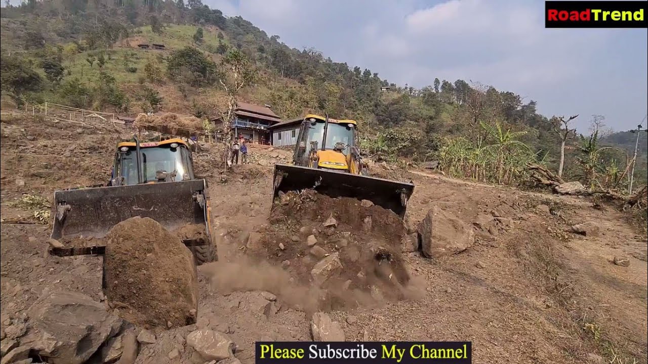 Jcb Backhoe machine pushing stone-Jcb machine working hill