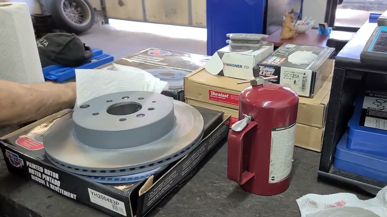 Front and Rear Brake Pads & Rotors on a 2010 Mazda CX-9