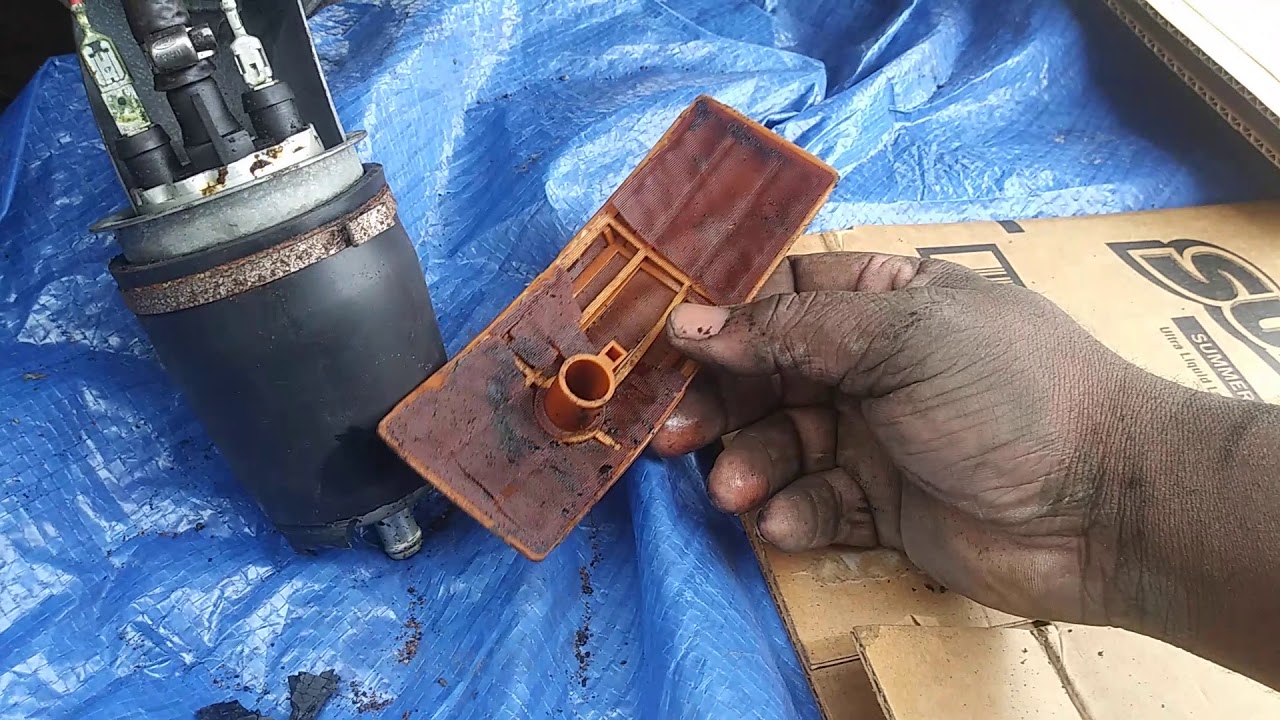 91 crown vic fuel pump replacement look how the gas ate up the fuel strainer and pump rubber