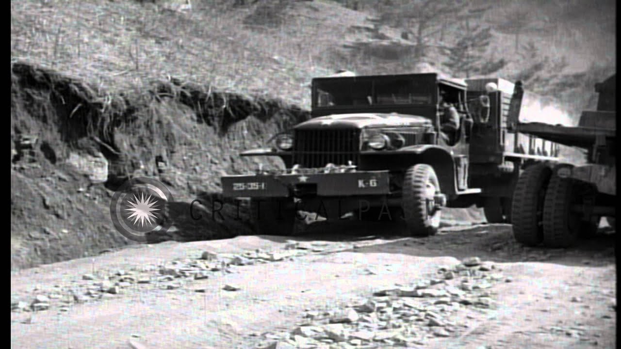 US army supply trucks come up road trail in the Kachil-Bong, Korea during Korean ...HD Stock Footage