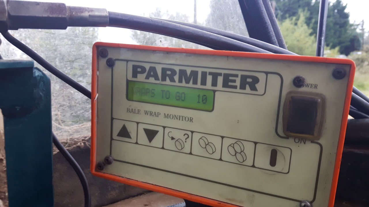 Wrapping bales with parmiter wrapper