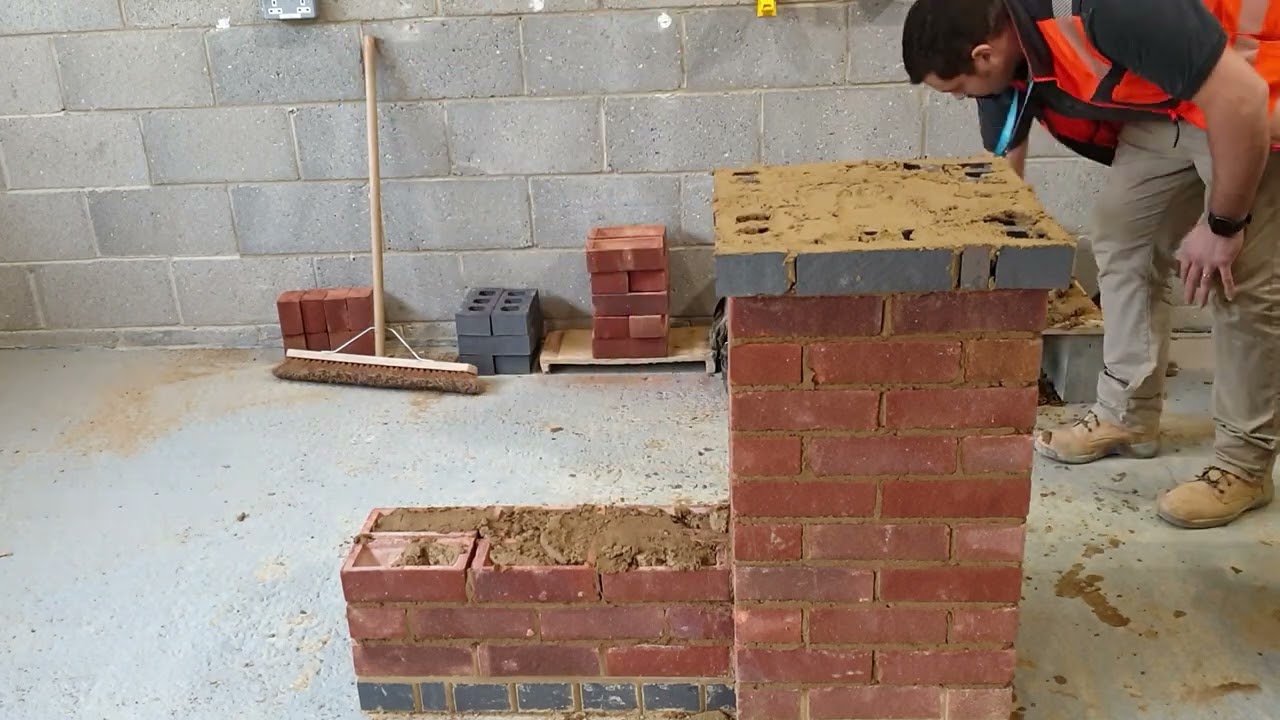 Brick solid wall 11 - Constructing the oversail course and Brick on Edge (BOE) capping.