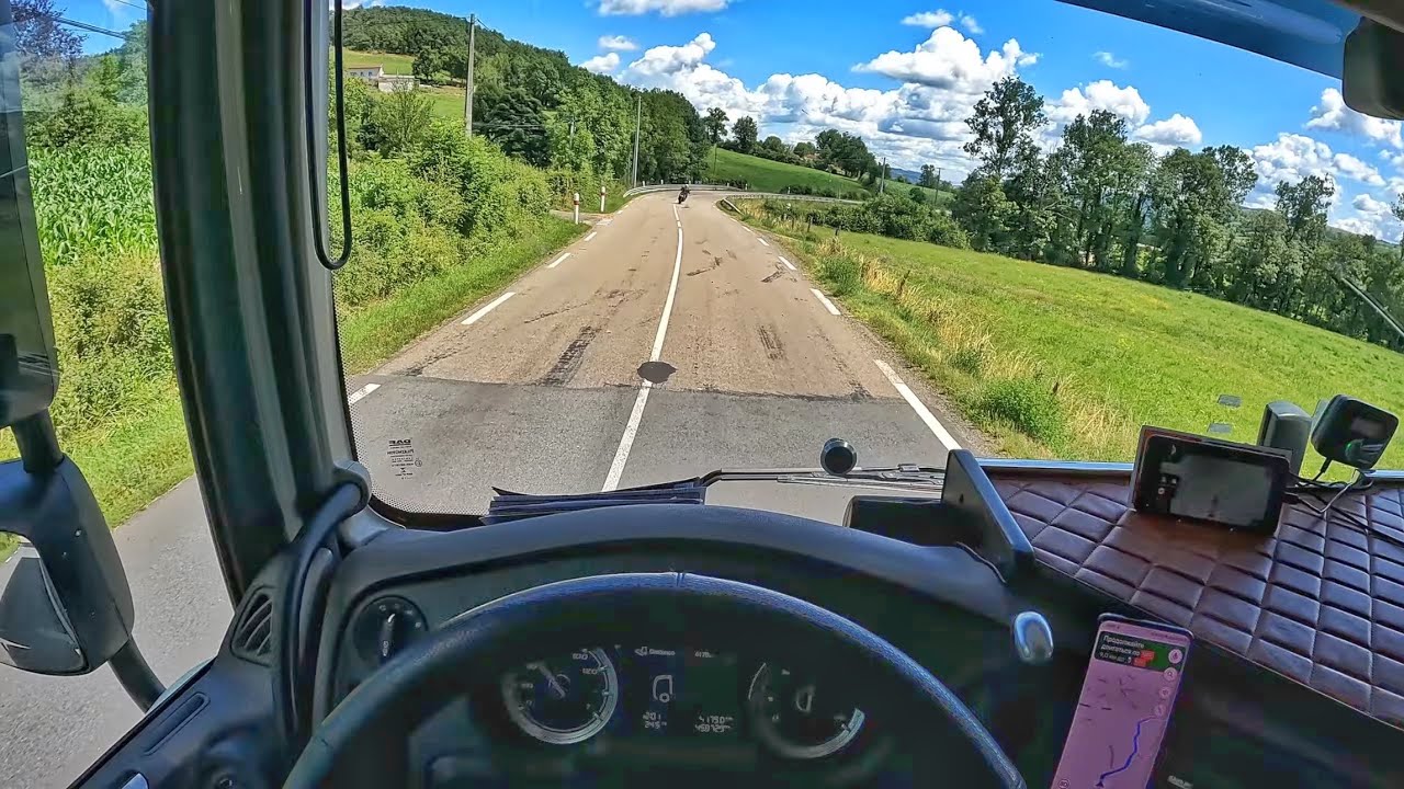 Driving a truck loaded with drinking water through French villages